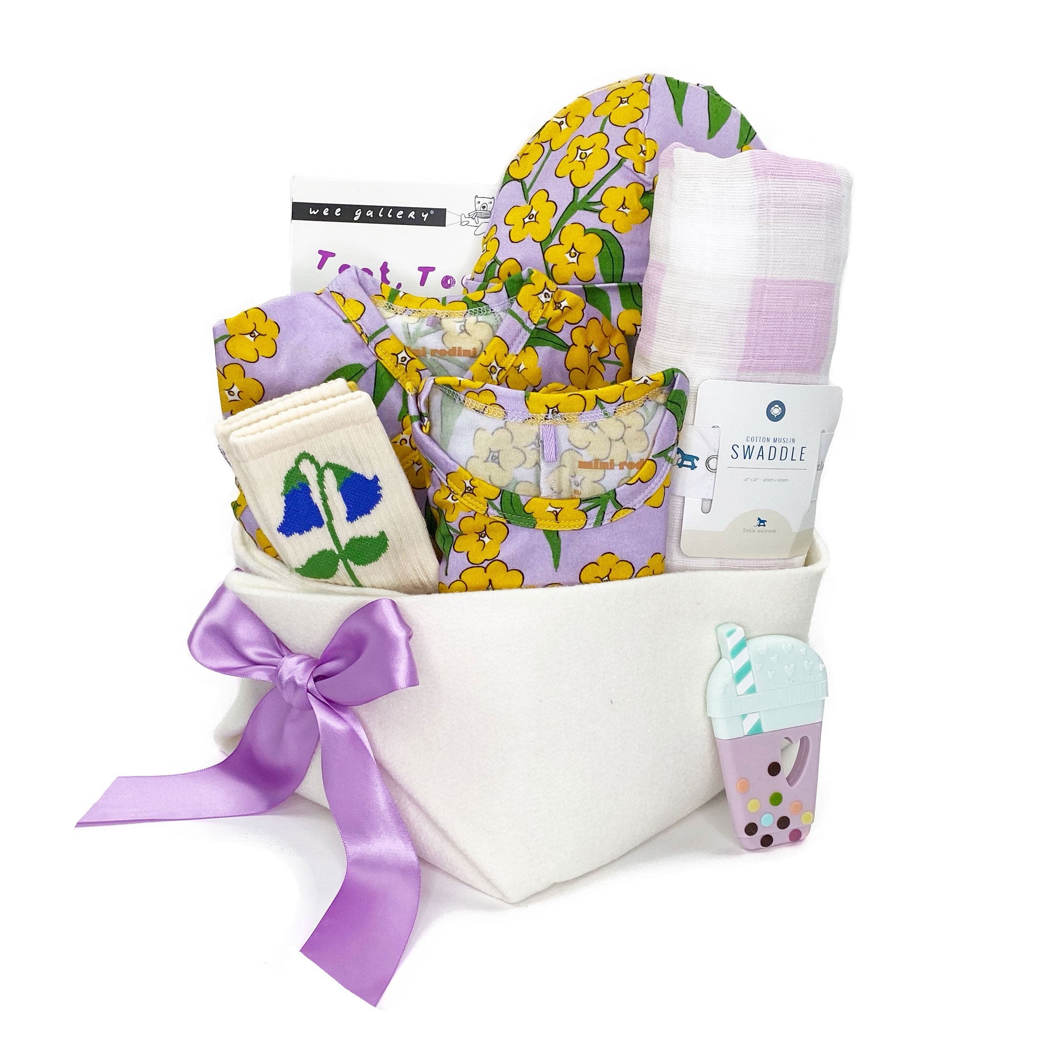 Mini Rodini Baby Girl Gift Basket  with winter flowers an adorable accessories at Bonjour Baby Baskets