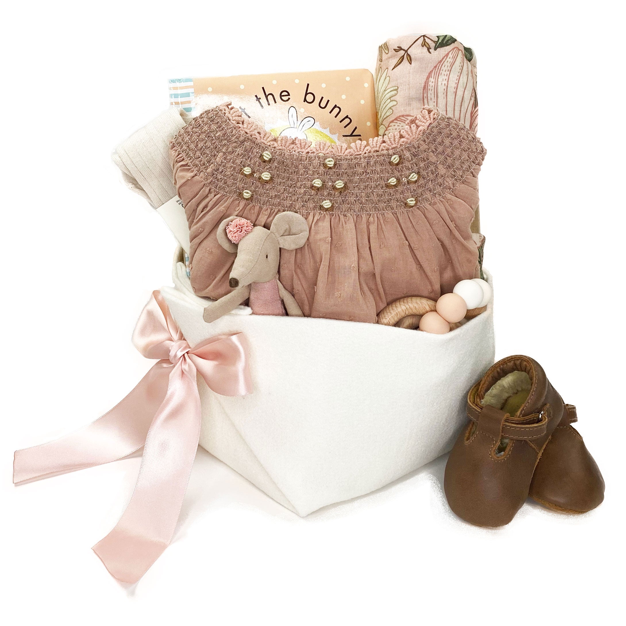 Luxury Baby Gift Basket featuring Noralee smocked dress and curated unique baby accessories at Bonjour Baby Baskets