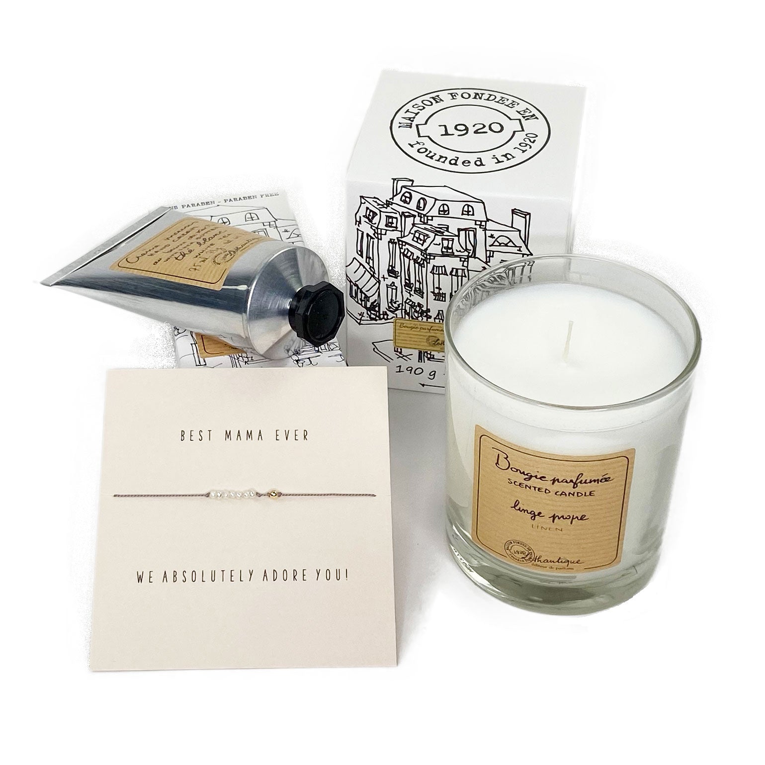 New Mom Gift at Bonjour Baby Baskets featuring a candle, hand cream and a bracelet