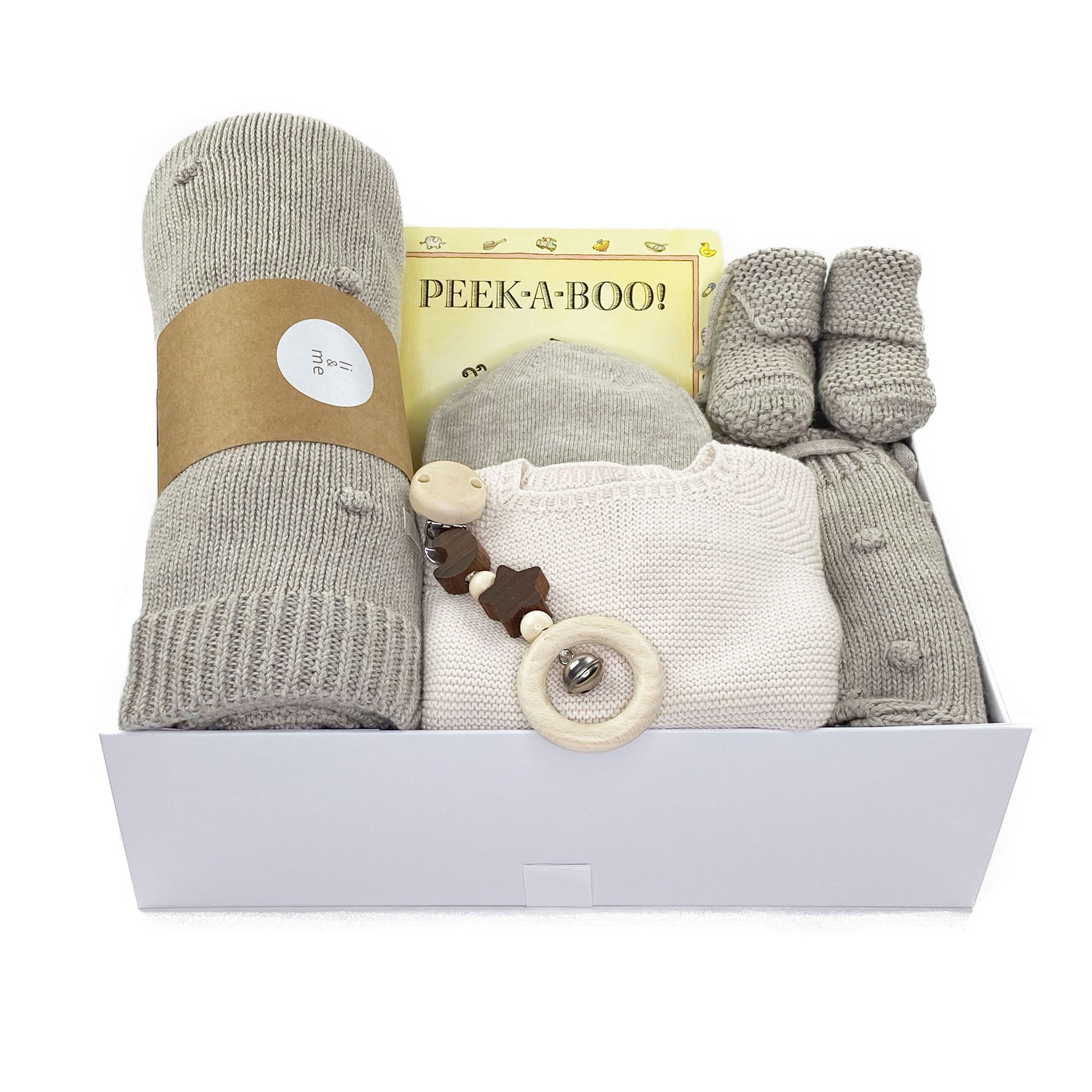 Luxury Baby Gift Box featuring neutral knitted clothing, blanket and adorable curated toys at Bonjour Baby Baskets