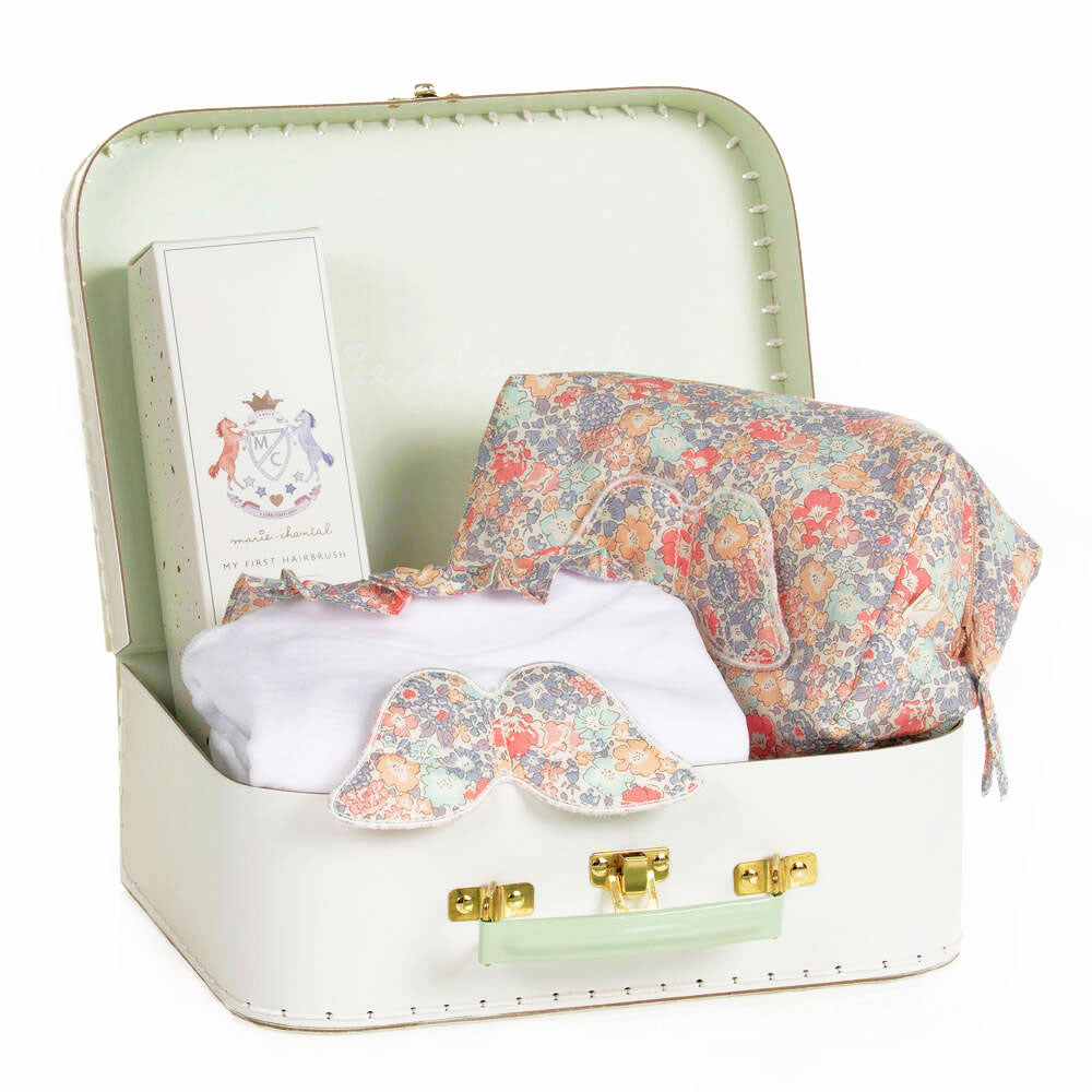 Luxury Marie Chantal Baby Girl Gift Box with Velour Romper, utility bag, baby hair brush and suitcase at Bonjour Baby Baskets