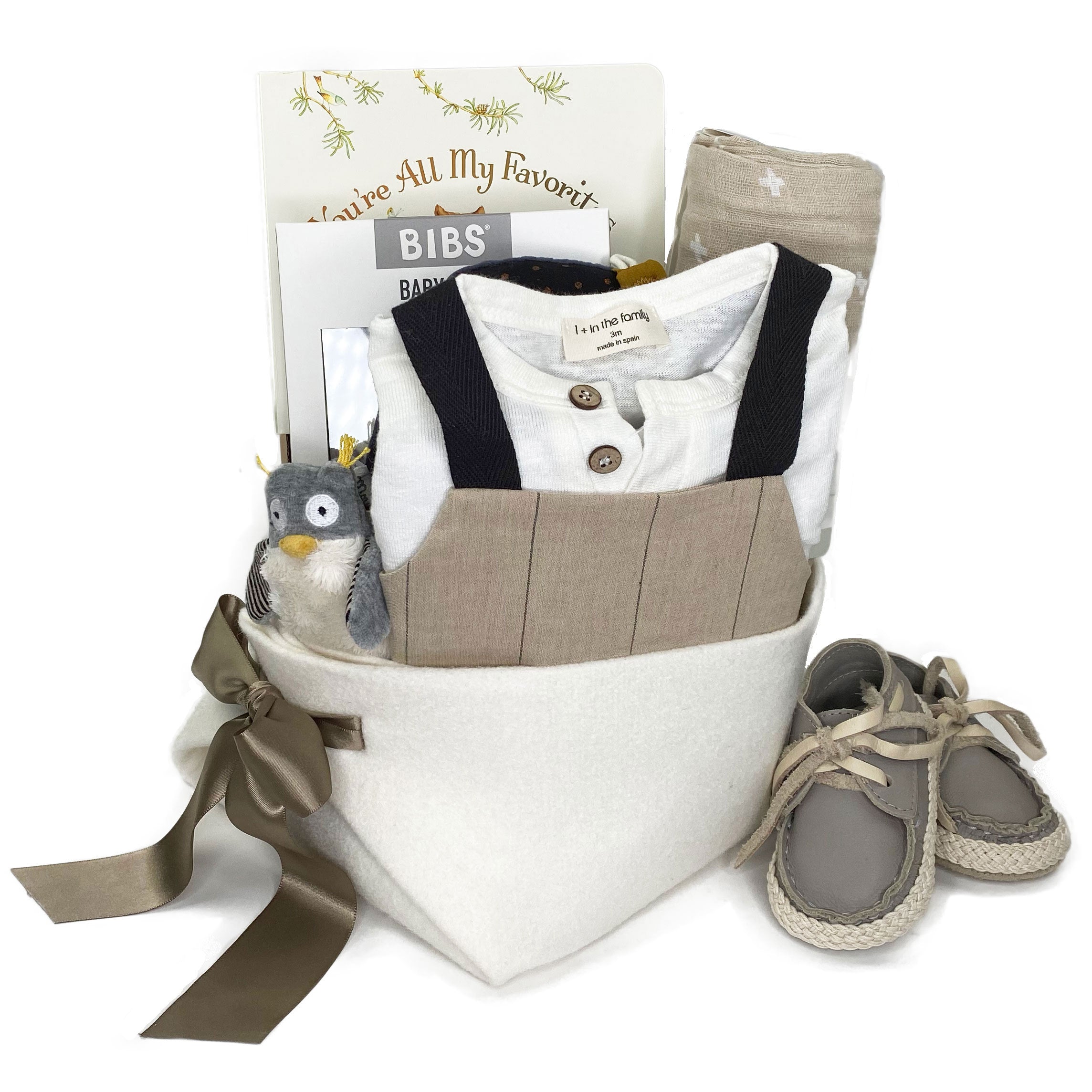 Luxury Baby Boy Gift Basket featuring linen romper, tee and hoodie by 1+ in the Family in earthy colours, leather shoes by Donsje Amsterdam and curated baby gifts for the best baby boy present. 